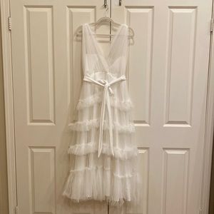 White tutu dress! Purchased for my engagement picture. Never worn in the end.